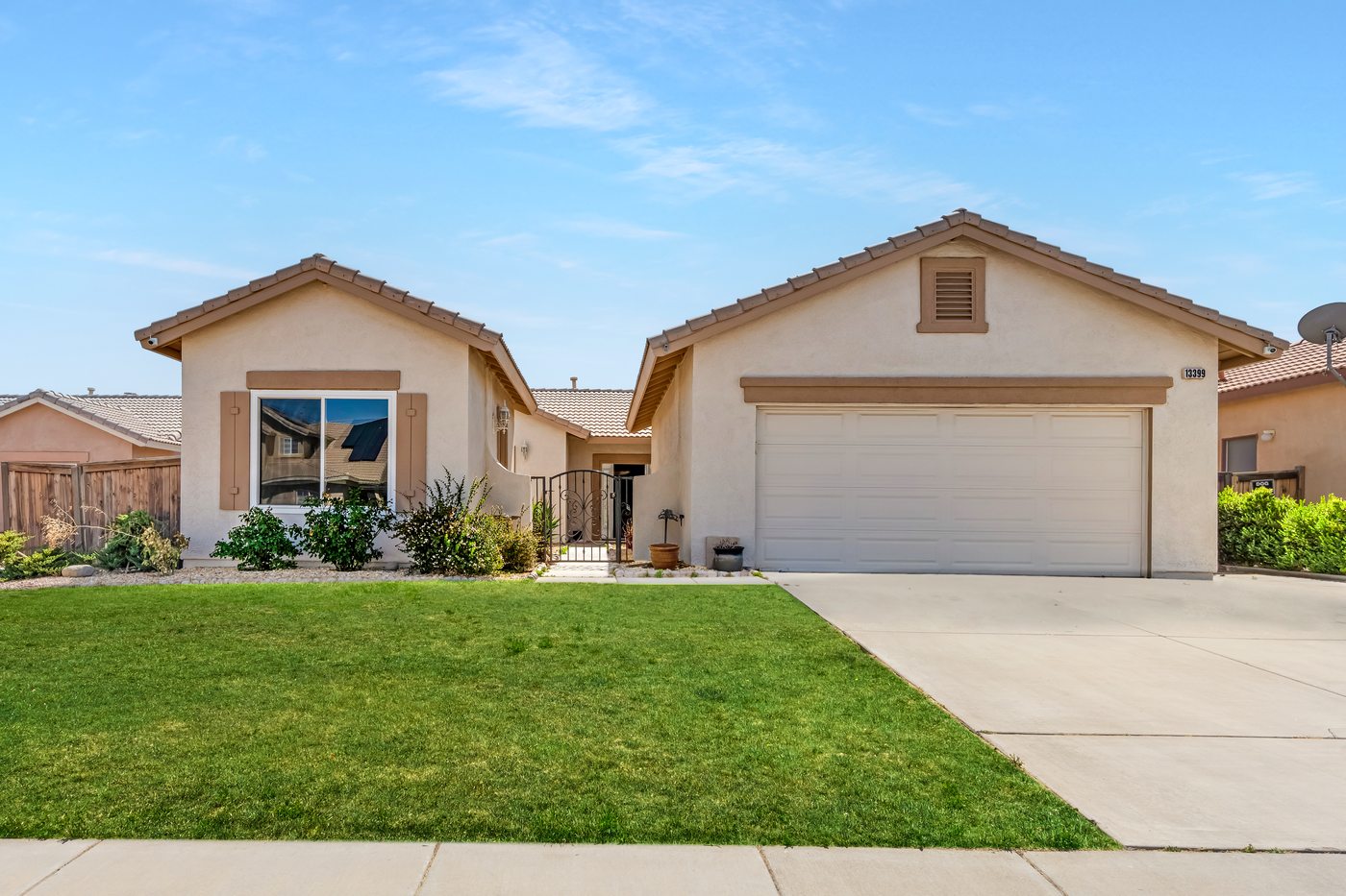 Single-story home with manicured front lawn