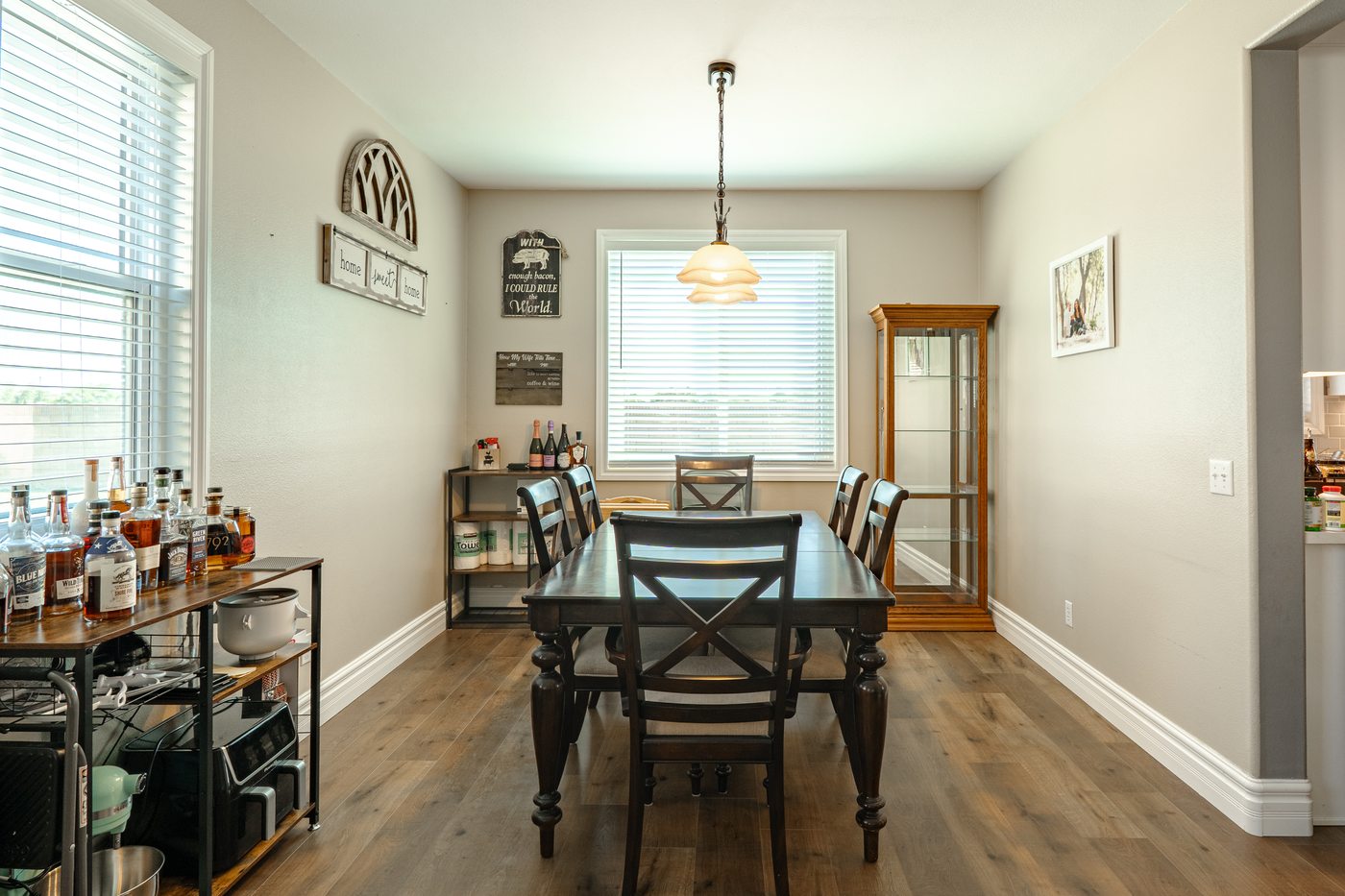 Spacious primary bedroom with french doors